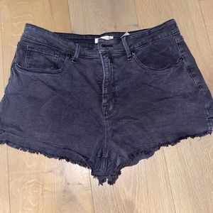 Good American black cut off denim shorts.